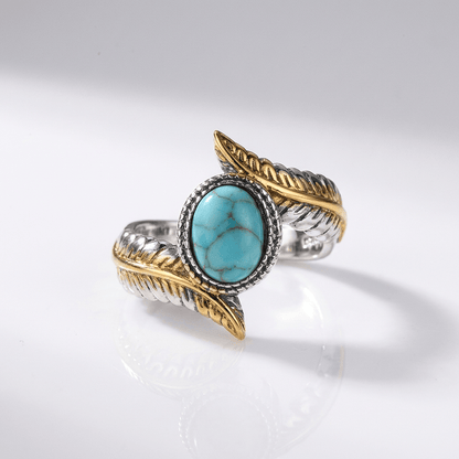 Bohemianischer Ring aus Silber, Gold und Türkis, mit künstlerischem Design von der Marke Rose & Oliver, der leuchtende und elegante Details aufweist.