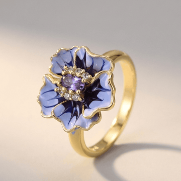 Anel Rose & Oliver Gold Blue Blossom com detalhes delicados em ouro e azul, elegante e feminino.