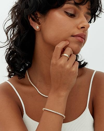 Goldenes Tennis-Armband von Rose & Oliver, zarter Stil mit Golddetails, ideal zur Ergänzung eleganter Looks.