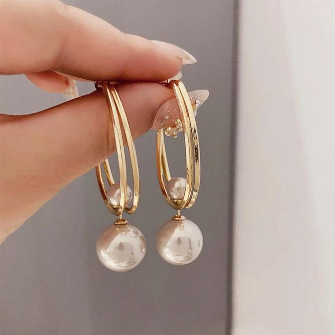 Vintage-Ohrringe von der Marke Rose & Oliver mit Perlen, eleganten Details und klassischem Roségold-Finish.